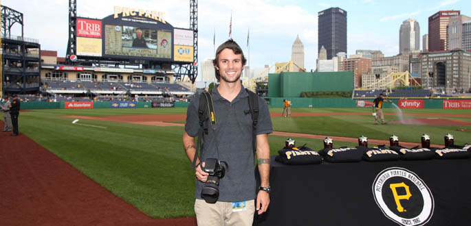 Pictured is photojournalism major Connor Mulvaney at PNC Park.