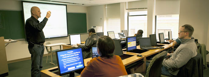 Pictured is IT professor Fred Kitner teaching class.