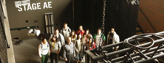 Pictured are SAEM students and instructor Ed Traversari at Stage AE.