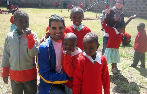 Education major Michael Suppa with students in Kenya.