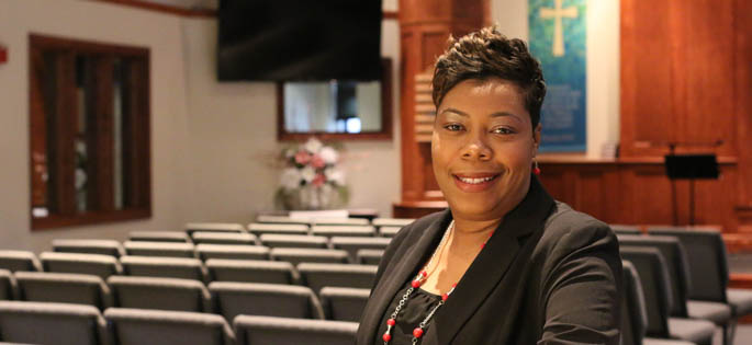 Pictured is Loleda Moman, 2014 M.A. in organizational leadership alumna and director of Care Connections Ministries for Allegheny Center Alliance Church. | Photo by Victoria A. Mikula
