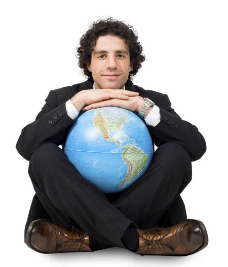 Pictured is a photo of business man holding a globe. | Stock photo purchased at istockphoto.com