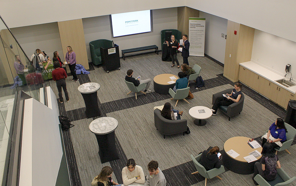 Pictured are students, alumni and faculty at a networking event. Photo by Kellie Strate.