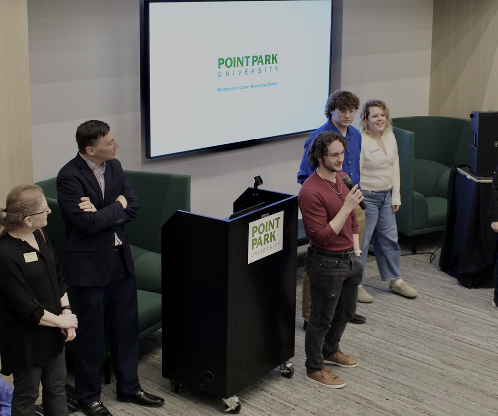 Pictured is Christian Rangel, president of the Pioneer Tech Innovators Club, speaking at a networking event in the Professional Career-Readiness Center. Photo by Kelli Strate.