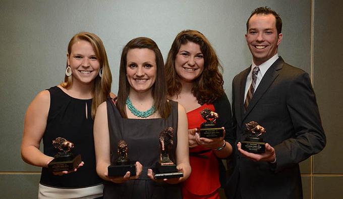 At an awards dinner on April 26, four students were named the outstanding senior in their school. Shown in this photo, left to right: Heidi Schlegel, Conservatory of Performing Arts; Karly Shorts, School of Arts and Sciences; Zoe Sadler, School of Communication; and Adam Sutermater, School of Business. | Photo by Jim Judkis