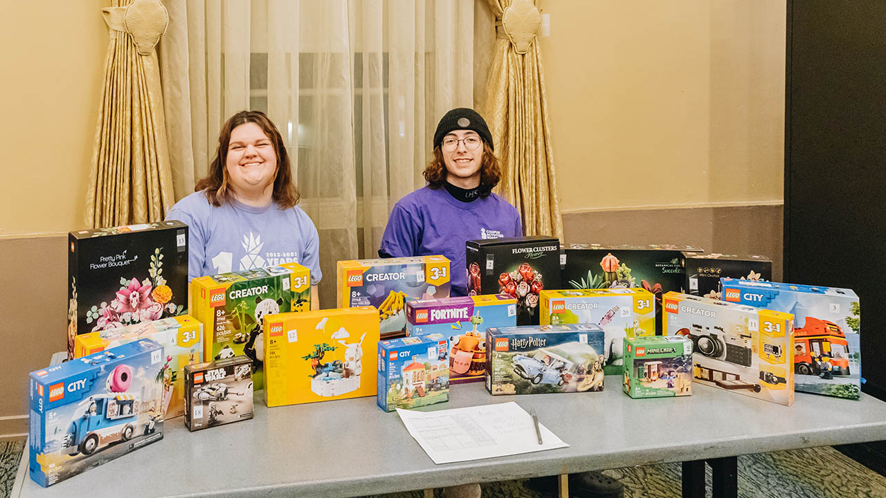 Point Park students run the prize table at Bingo.