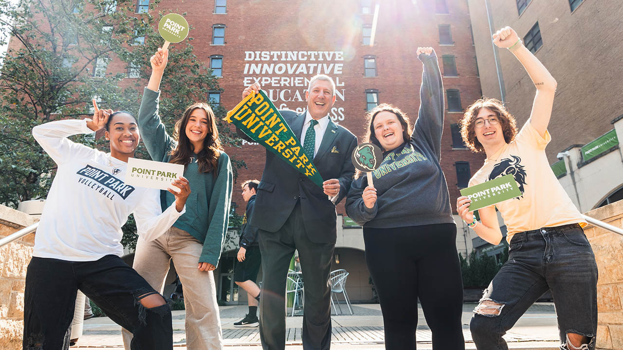 Point Park students with President Chris W. Brussalis in Village Park. 