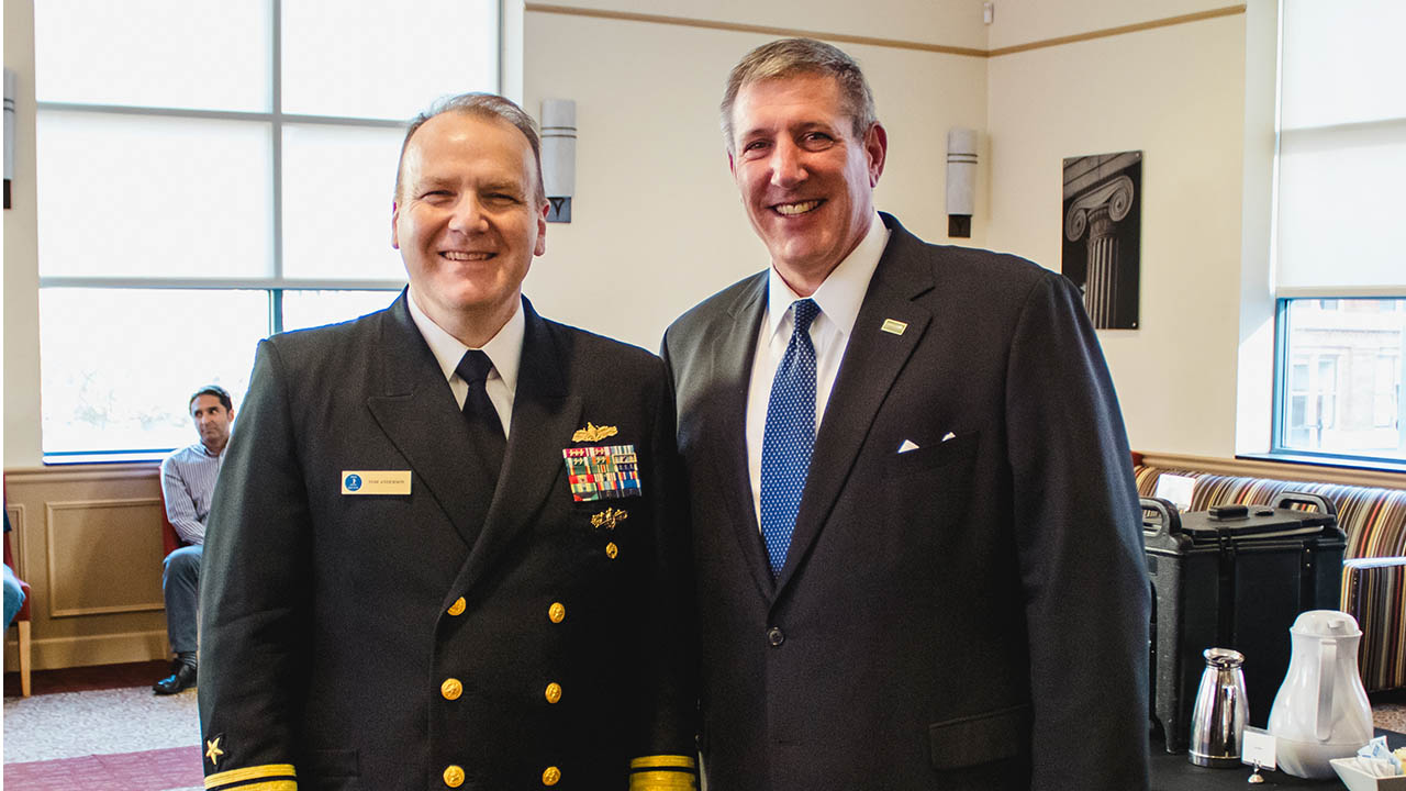 Rear Admiral Thomas Anderson poses for a photo with Dr. Chris Brussalis, president of Point Park. 