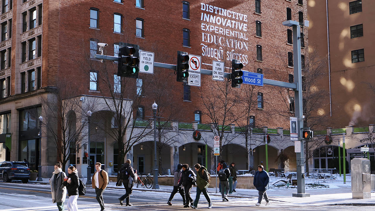 Students crossing the Boulevard of the Allies on a cold, January day. Photo | Nadia Jones