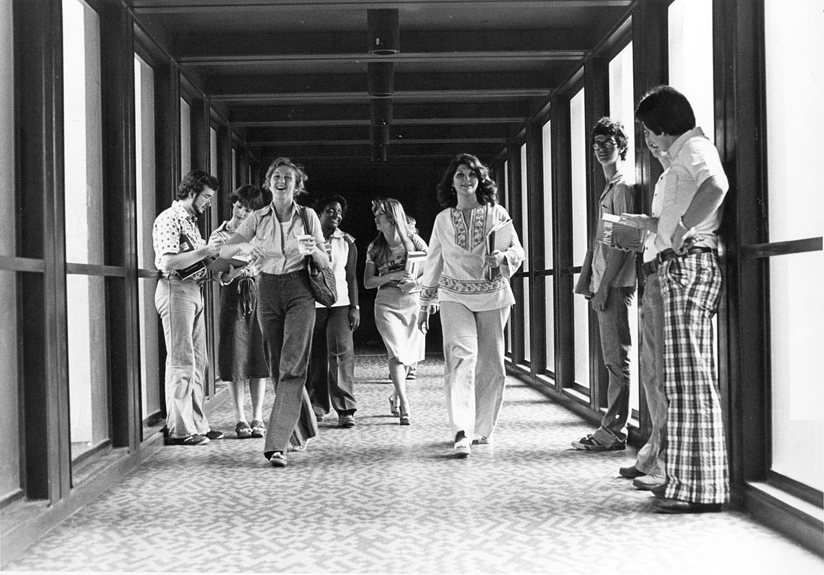 Students stand on a skybridge