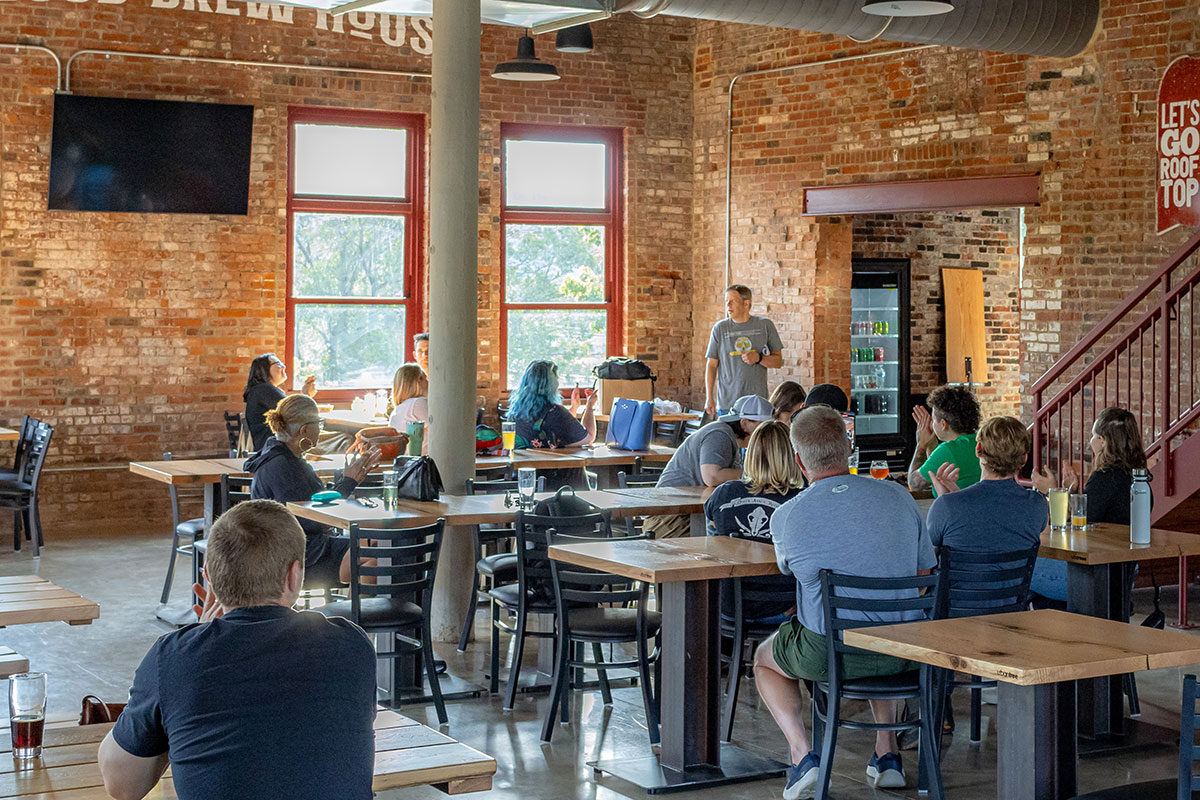 A group of brewing students gather in a restaurant