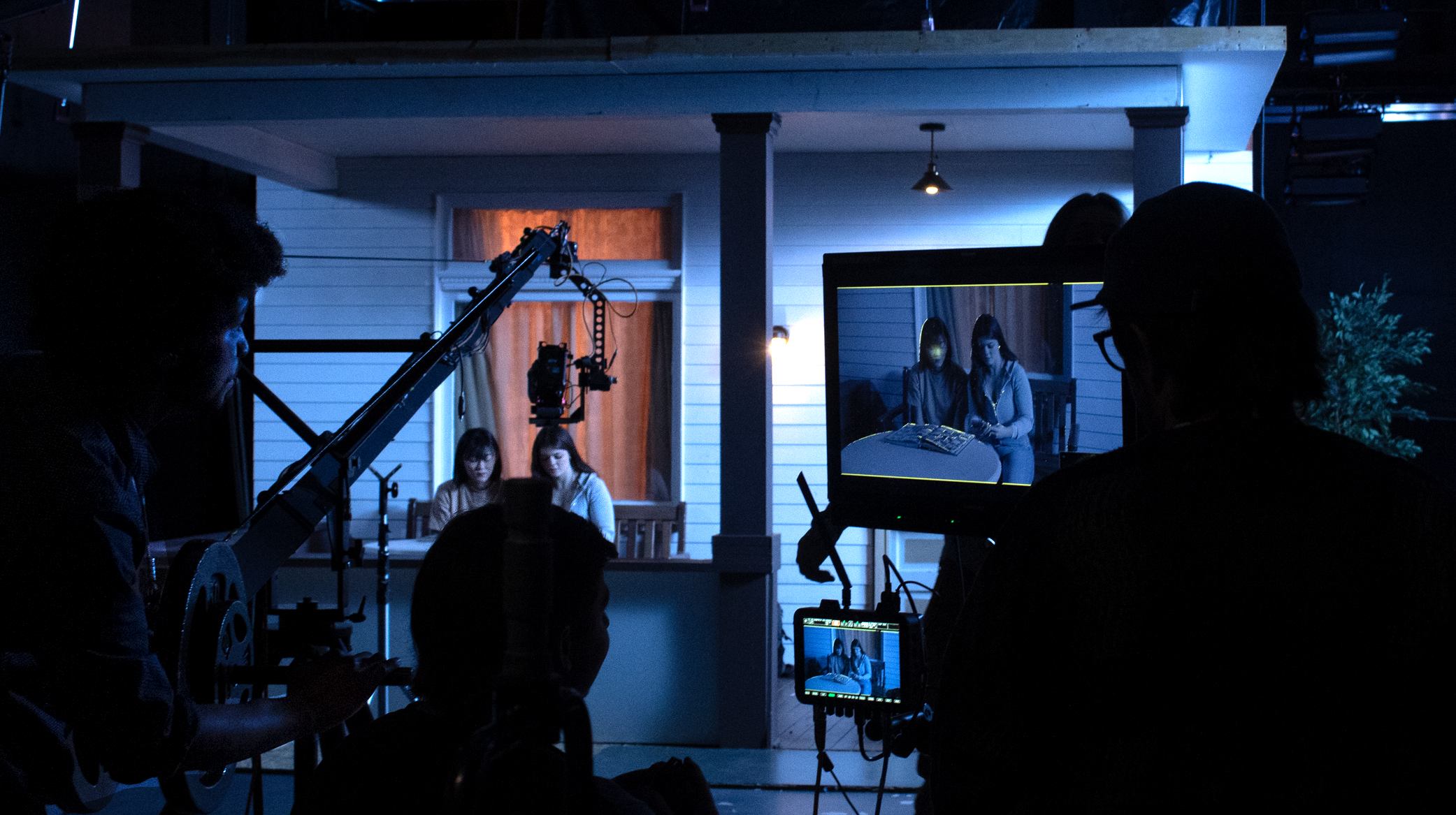 Students on set of a film shoot in the soundstage on campus. 