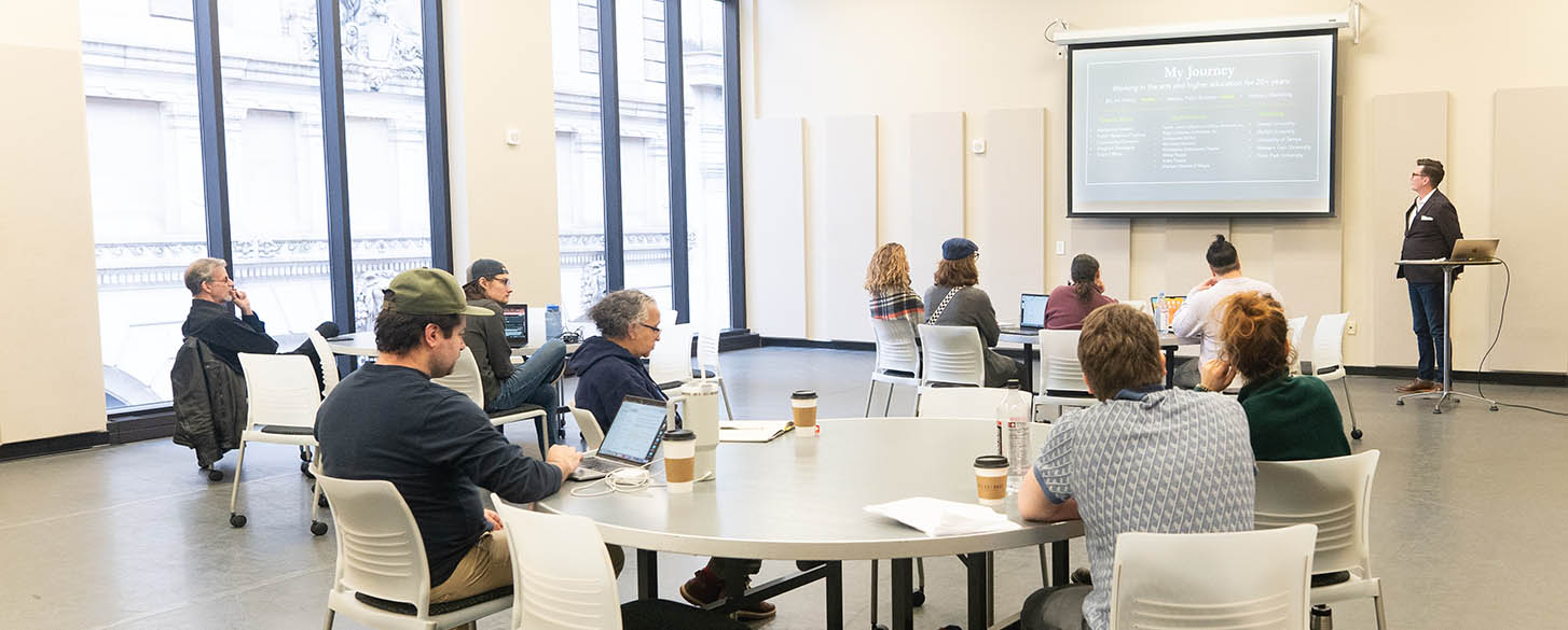 MFA Interdisciplinary Arts students attend a session with John Van Heest in the University's Pittsburgh Playhouse. 