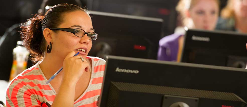 Female student in a computer lab during class