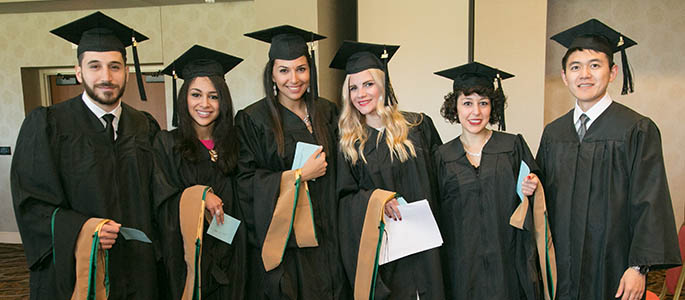 Pictured are students at the 2015 master's degree Hooding and Degree Conferral ceremony. Photo | John Altdorfer