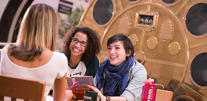 Taylor Schultz, a fourth year acting major from Pittsburgh in the blue scarf, talks to Catherine Jenkins, a mass communication major from Butler, Pa. with her back to us, and Jennifer Florentino, a dance major. Photo | John McKeith