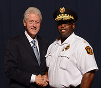 Pictured is Eric Holmes with President Bill Clinton. Photo submitted by Holmes.