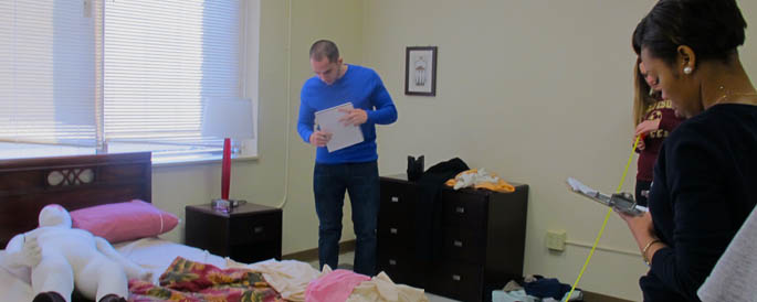 Pictured are Point Park forensic science students in the CSI house on campus. | Photo by Amanda Dabbs