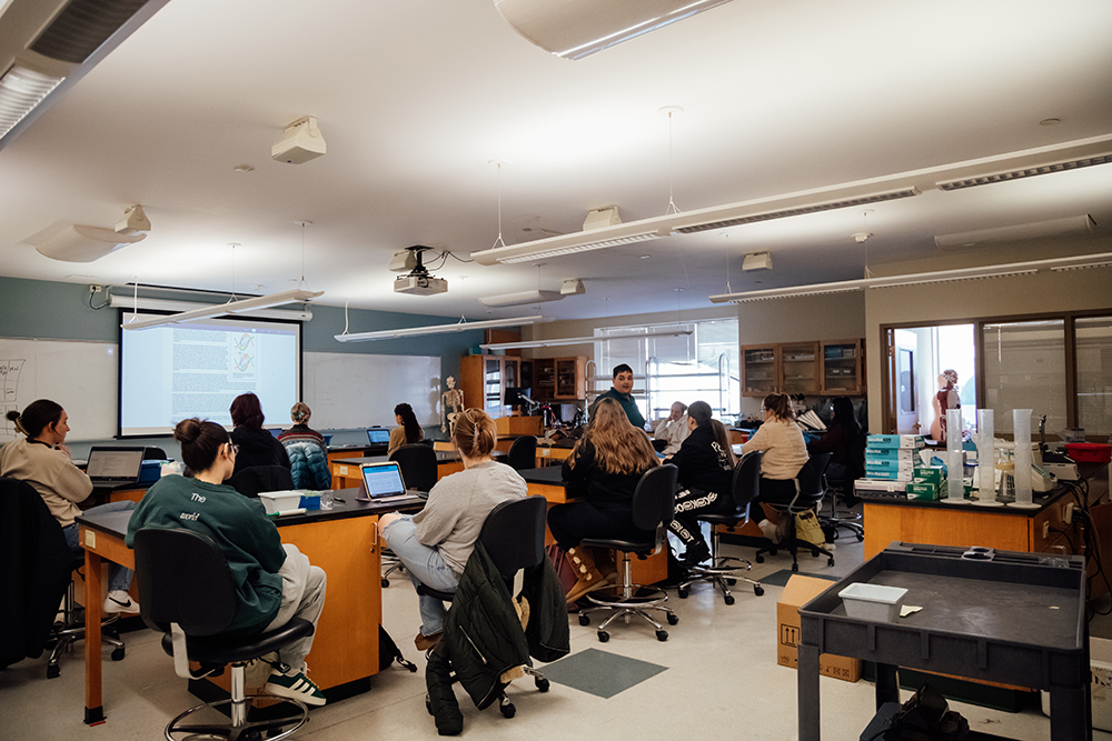 Pictured is Brandon Dimick teaching a class of biological sciences students. Photo by Ethan Stoner.