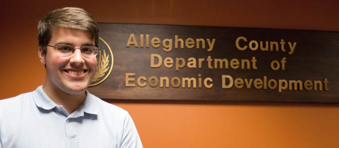 Pictured is Joseph Buckel, a business management student and intern for Allegheny County Department of Economic Development's Save your Home program. | Photo by Lexie Mikula