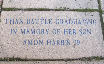 Pictured is a memorial brick in Point Park's Alumni Park that accelerated business alumna Tyian Battle has in memory of her son Amon Harris. | Photo by Amanda Dabbs
