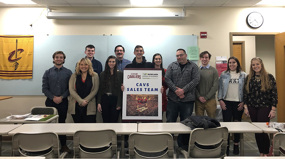 Pictured is SAEM alumna Dana Drewniak with SAEM students in the classroom. Photo by Amanda Dabbs