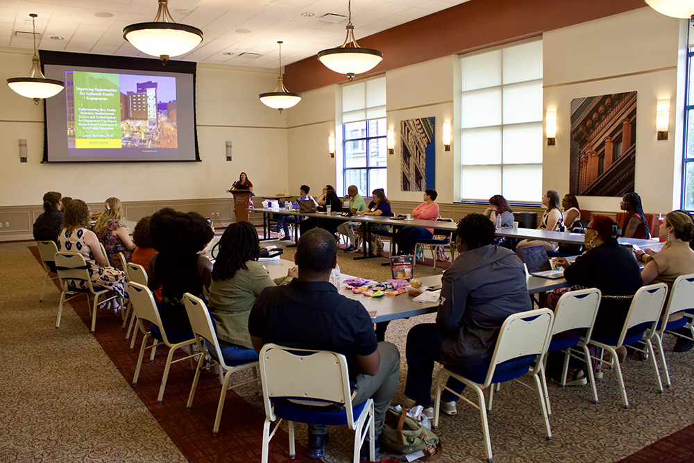 Pictured are students attending a presentation during the Ph.D. in Community Engagement program's welcome weekend. Photo by Nadia Jones.