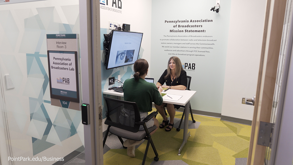 Pictured are Professor Dorene Ciletti and student Natalie Caine in the Michael P. Pitterich Sales & Innovation Center. Photo by Randall Coleman.