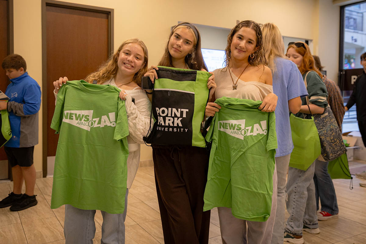 High school students with Newsapalooza shirts and Point Park bags. 