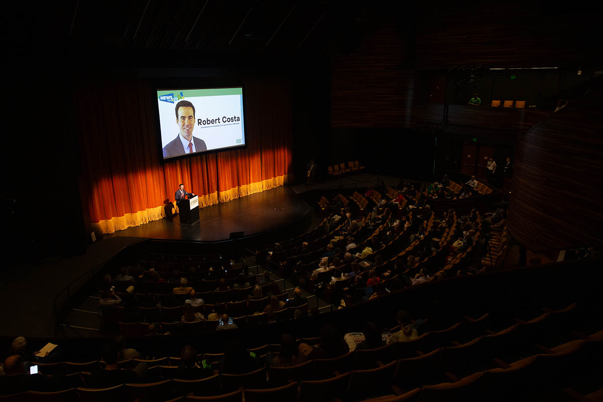 Robert Costa speaks to the crowd.