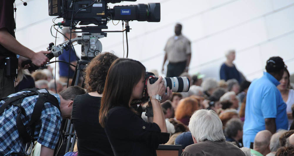 Cheryl Mann photographing at the Pritzker Pavillion in Chicago.