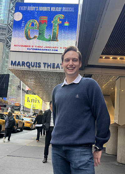 Pictured is Austin Schulte in front of the Marquis Theatre in New York City. 