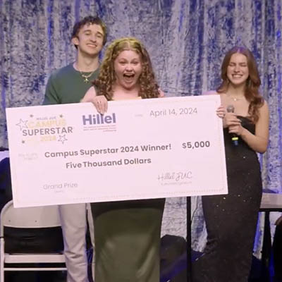 Pictured is Cammi Caldwell receiving her check from the Campus Superstar competition.