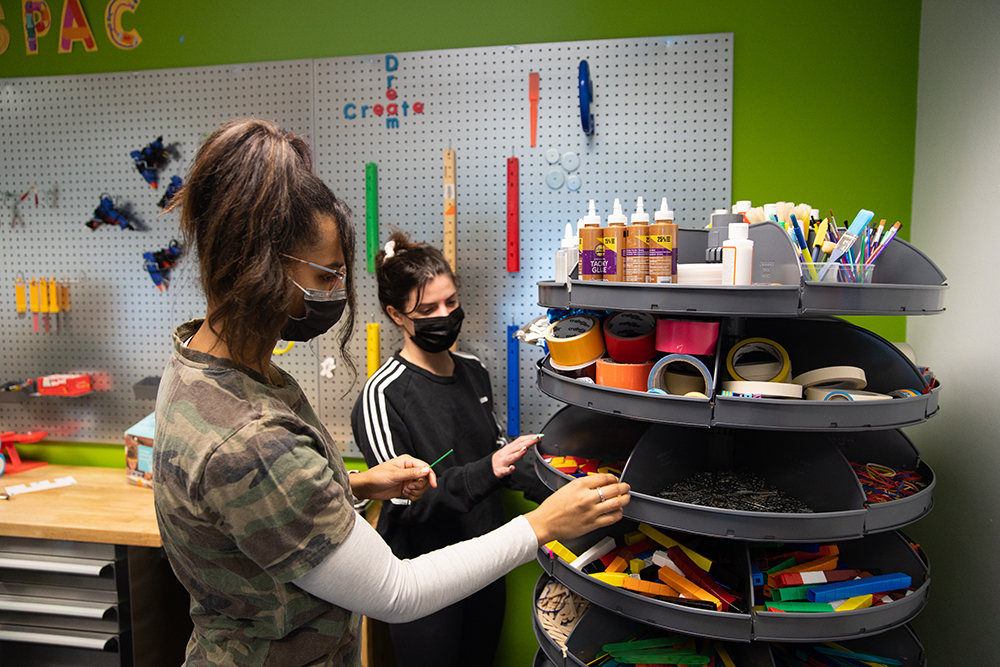Students look through materials in the workshop area of Matt’s Maker Space Lab. Photo by Randall Coleman.