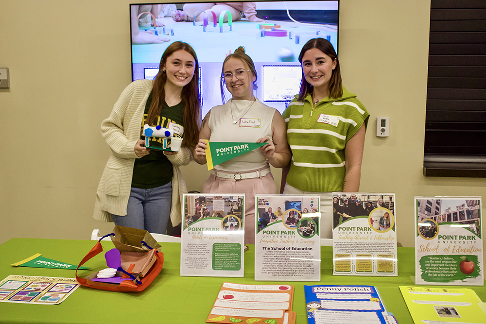 Pictured are student Courtney Parrish and alumni Katlyn Proof and Emily Palma at the Remake Learning assembly. Photo by Nadia Jones.