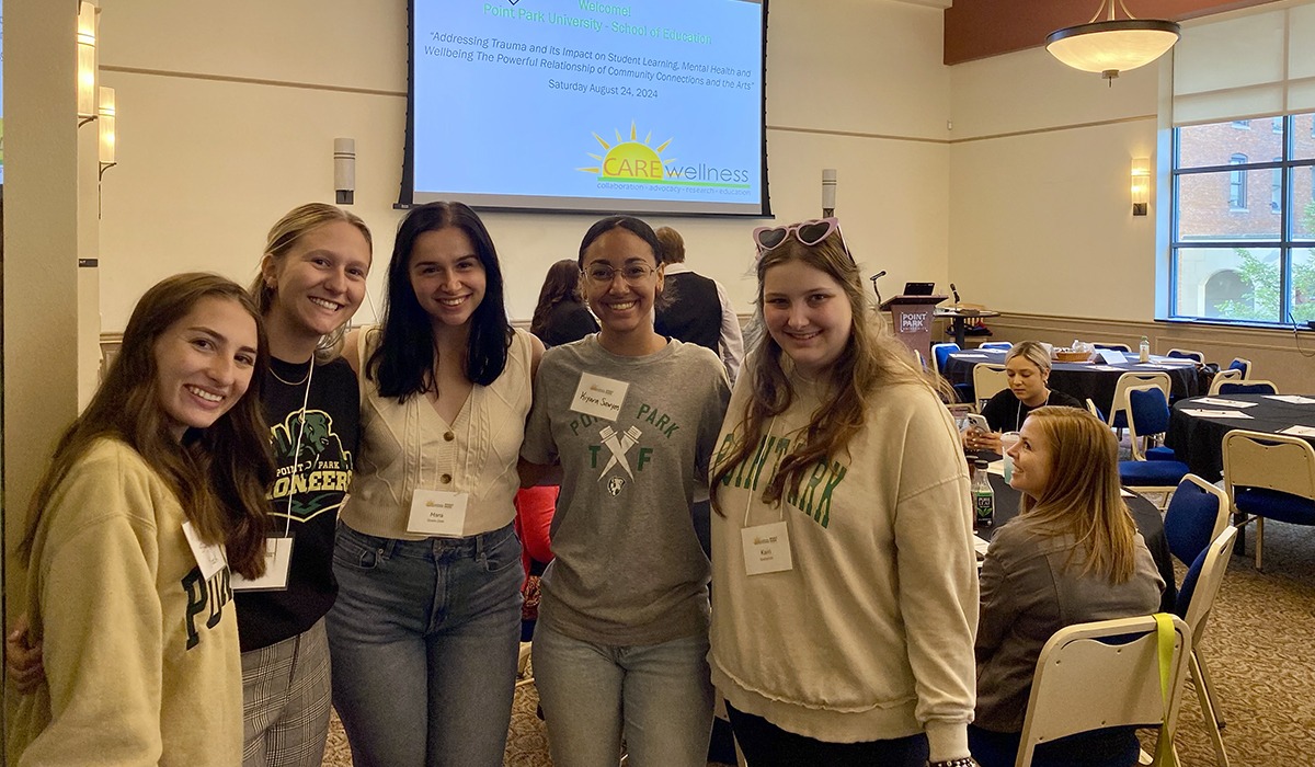 Undergraduate students Sarah Rock, Lily Marchand, Mara Shene, Kiyara Sawyers and Kairi Stallsmith volunteered at the symposium.