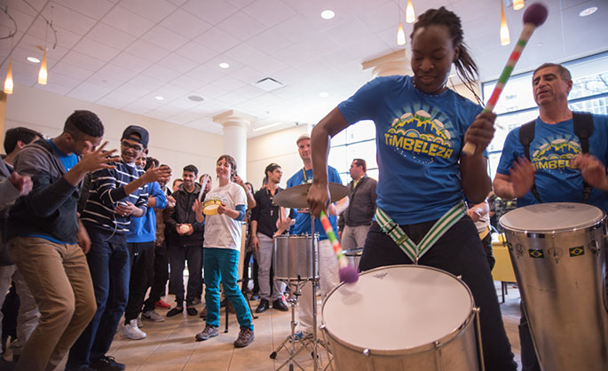 Drummers from Timbeleza, a Brazilian drum band, perform in Lawrence Hall as Point Park students move to music at the annual Global Festival Celebration March 19. | Photo by Christopher Squier