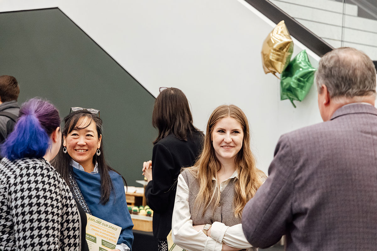 People mingle at the PCRC opening.