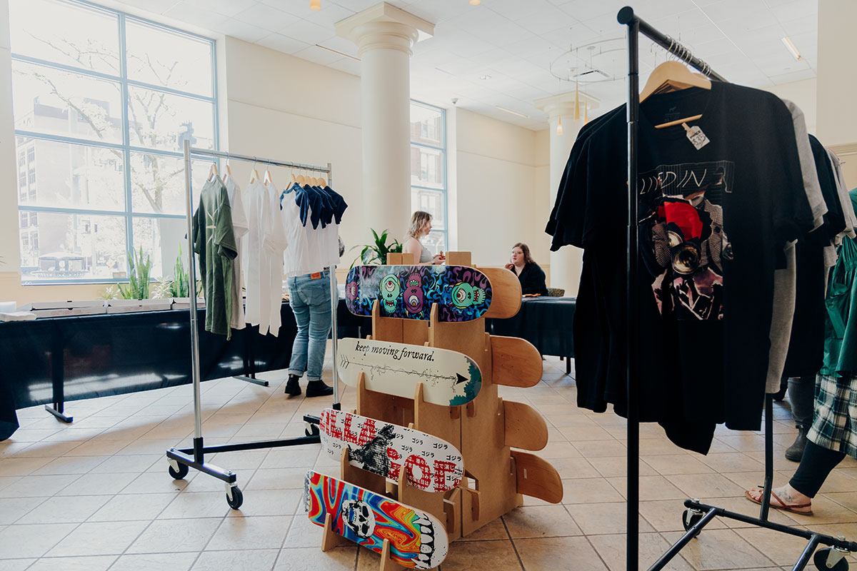 Items such as clothing, skateboards and art are displayed.