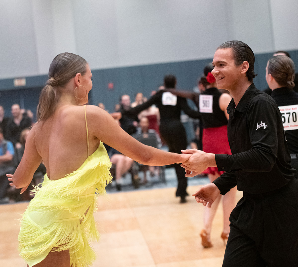 Two ballroom dance students compete. 