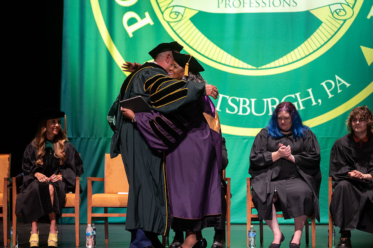 President Brussalis and President Humphrey embrace.