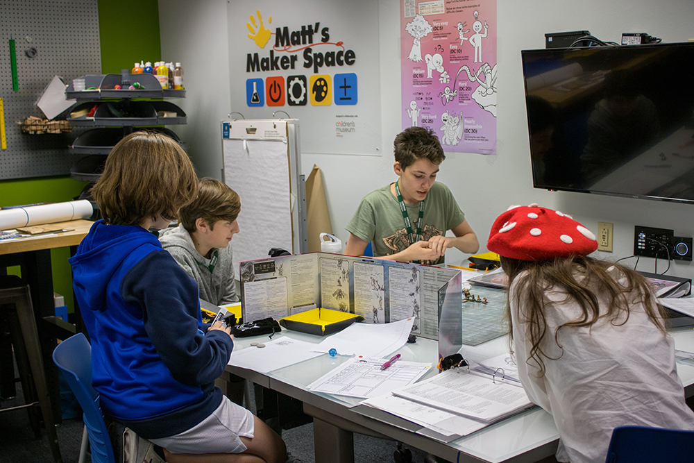 Pictured are students playing Dungeons & Dragons in Matt's Maker Space at Point Park University. Photo by Nadia Jones. 