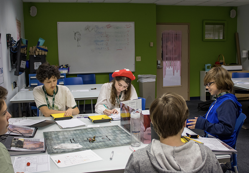 Pictured are students playing Dungeons and Dragons in the Matt's Maker Space classroom at Point Park. Photo by Nadia Jones.