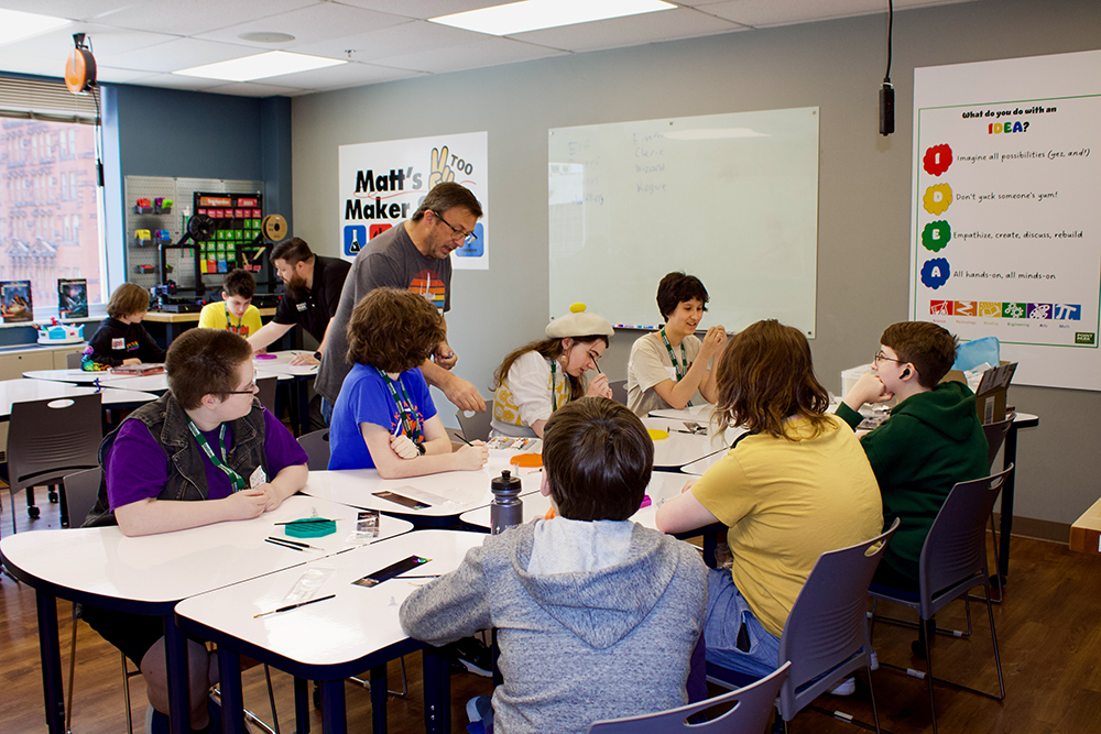 Pictured are students painting miniatures in Matt's Maker Space. Photo by Ethan Stoner.