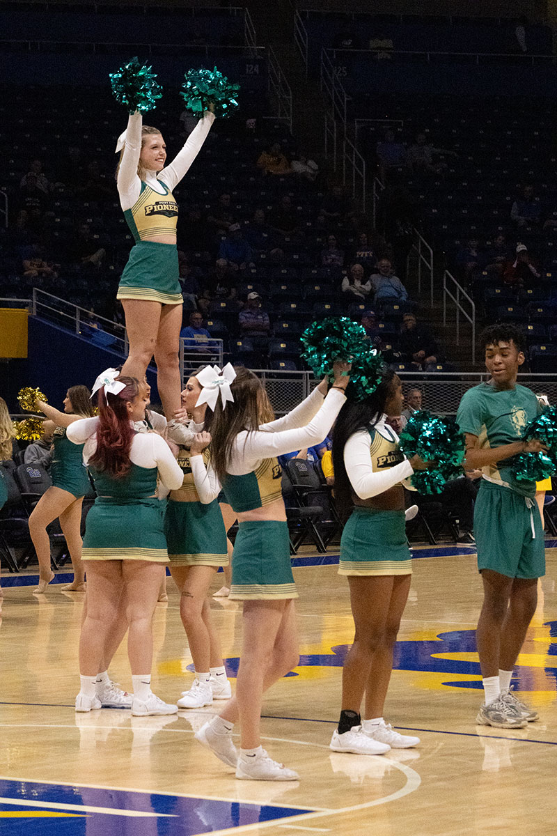 Cheerleaders on the sidelines of a game.